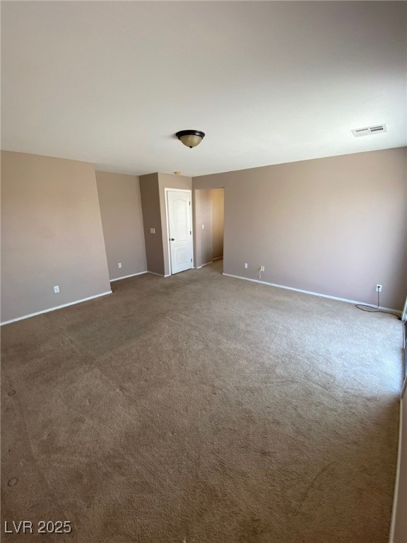 5817 Addy Lane, Unit N North Las Vegas, NV 89081 - Photo 23 of 32 Carpeted spare room featuring baseboards