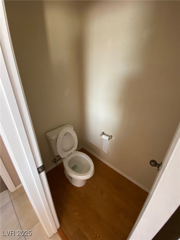 5817 Addy Lane, Unit N North Las Vegas, NV 89081 - Photo 26 of 32 Bathroom featuring toilet and wood finished floors