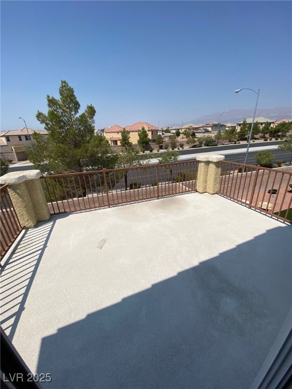 5817 Addy Lane, Unit N North Las Vegas, NV 89081 - Photo 30 of 32 View of patio featuring a residential view