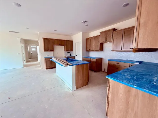 a front view of a house with a yard table and chairs