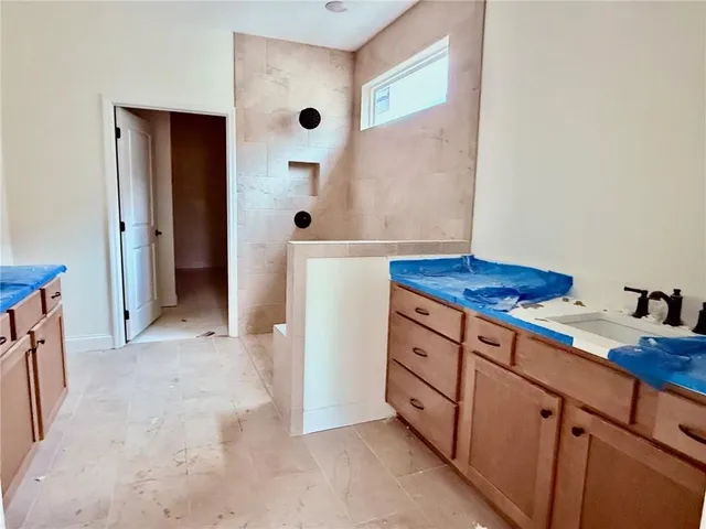 a view of a patio with dining table and chairs with plants