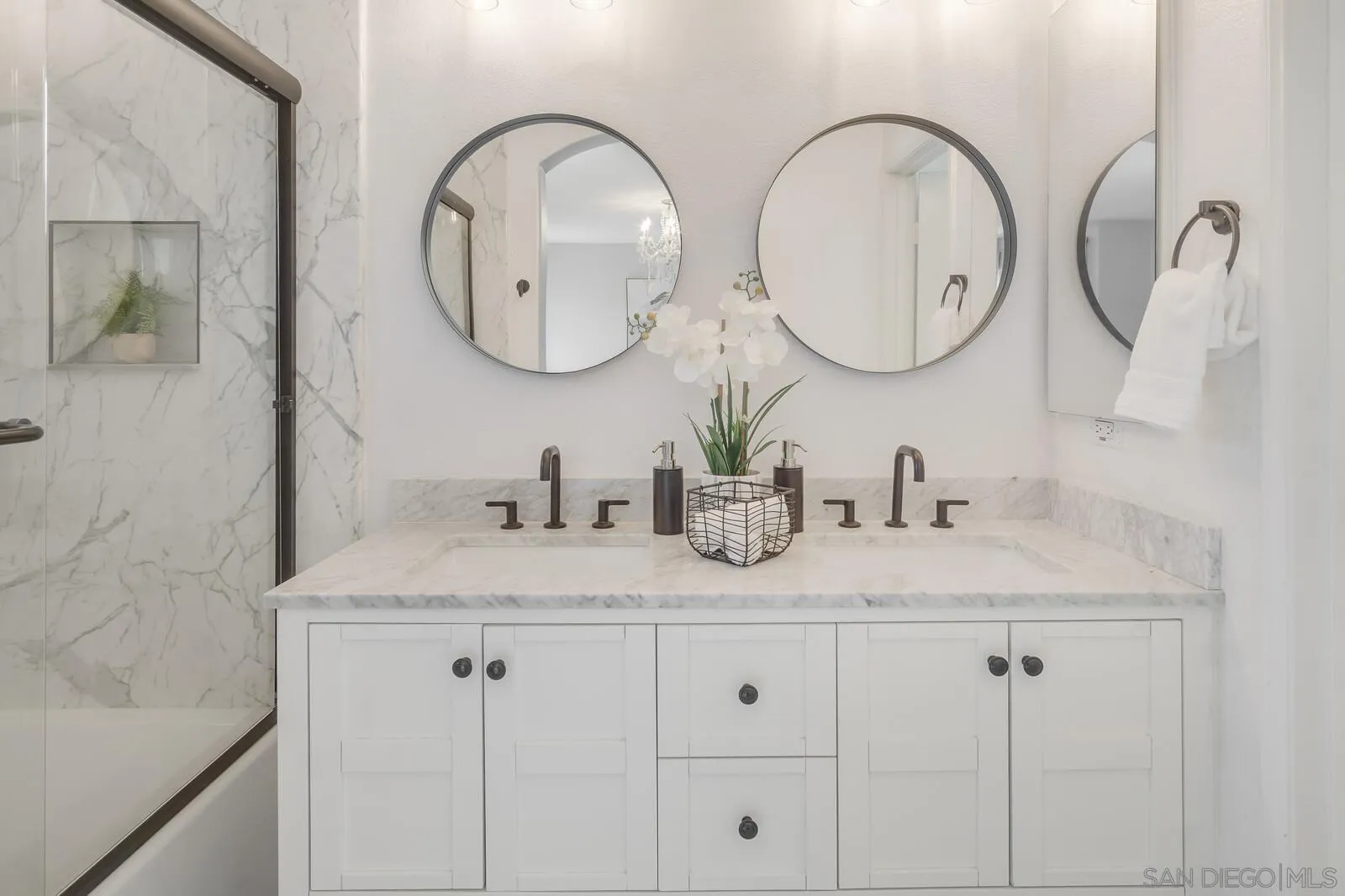 2252 Huntington Point Road, Unit 87 Chula Vista, CA 91914 - Photo 13 of 26 a bathroom with a granite countertop sink a mirror and a shower