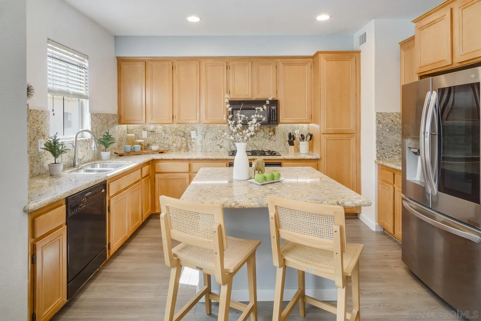 2252 Huntington Point Road, Unit 87 Chula Vista, CA 91914 - Photo 6 of 26 a kitchen with stainless steel appliances granite countertop a stove a sink a microwave and a refrigerator