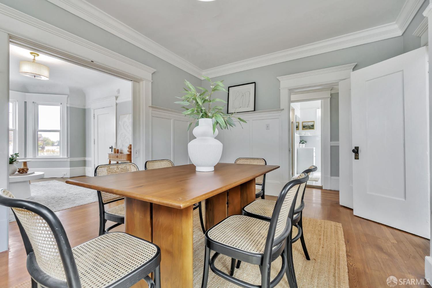 1180 Jackson Street, Unit 6 San Francisco, CA 94109 - Photo 13 of 48 a view of a dining room with furniture and wooden floor