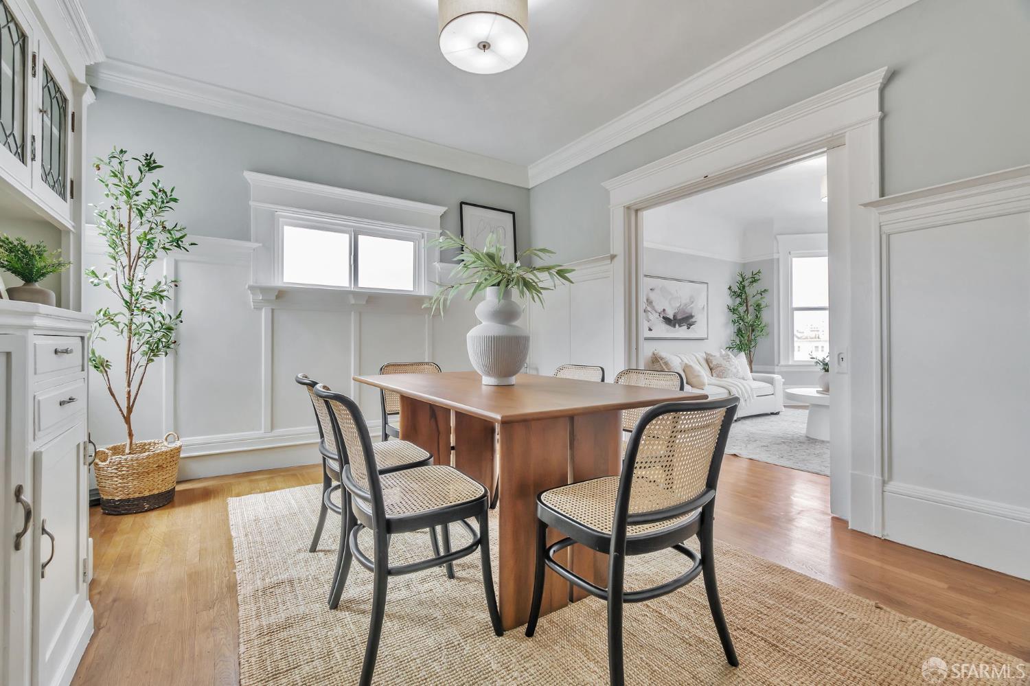 1180 Jackson Street, Unit 6 San Francisco, CA 94109 - Photo 14 of 48 a dining room with furniture potted plants and wooden floor