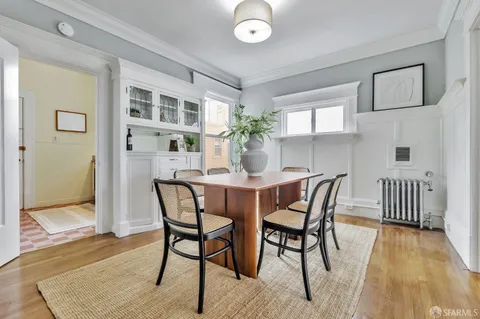 a dining room with furniture and window