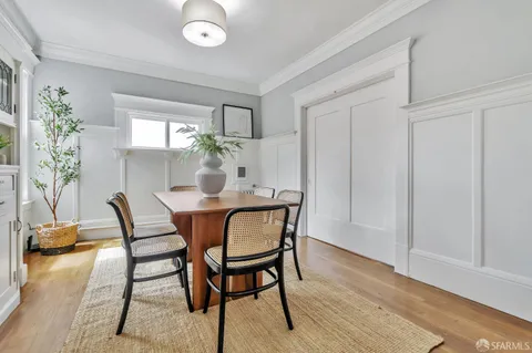 a dining room with furniture and window