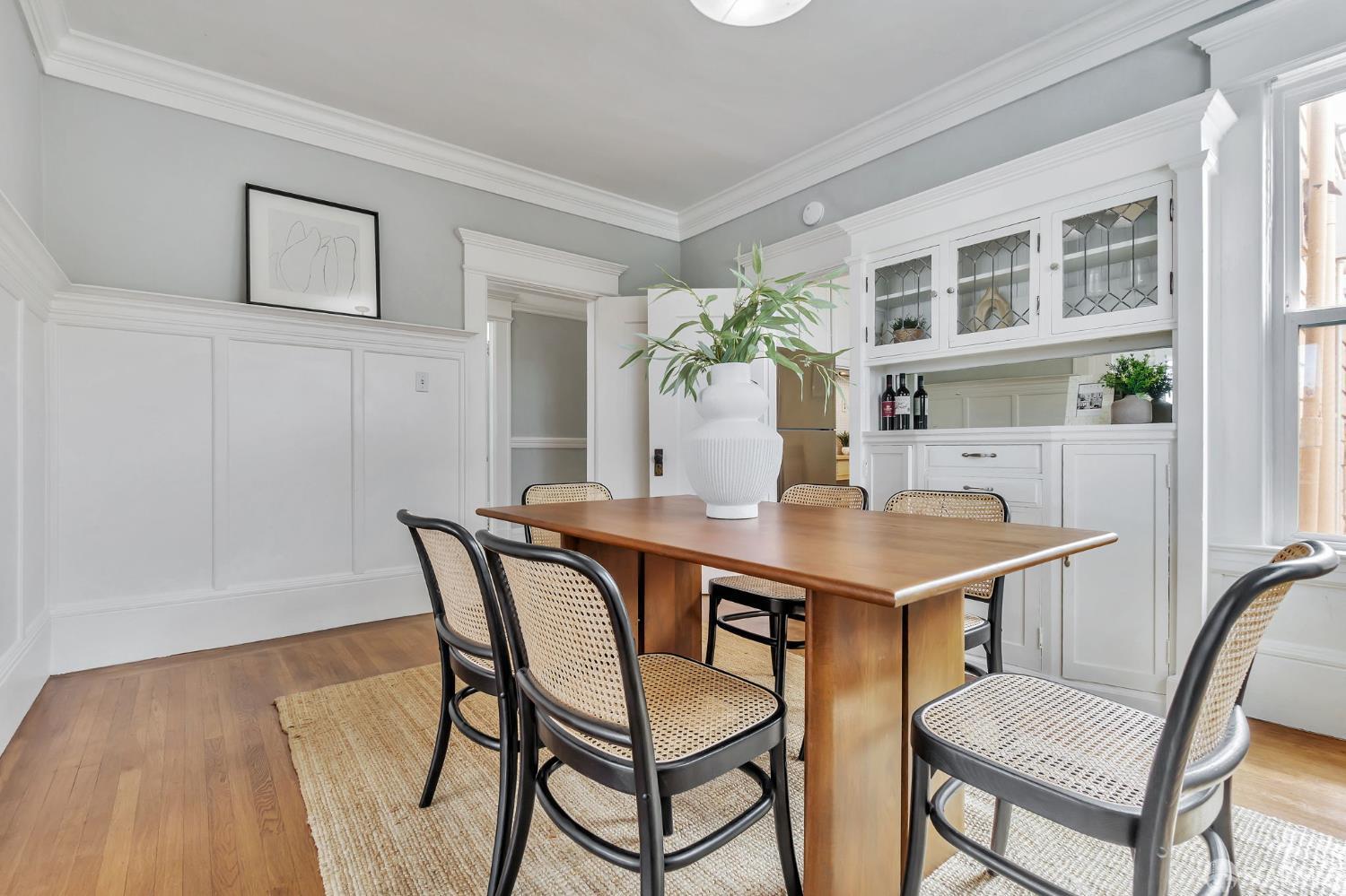 1180 Jackson Street, Unit 6 San Francisco, CA 94109 - Photo 17 of 48 a view of a dining room with furniture and window
