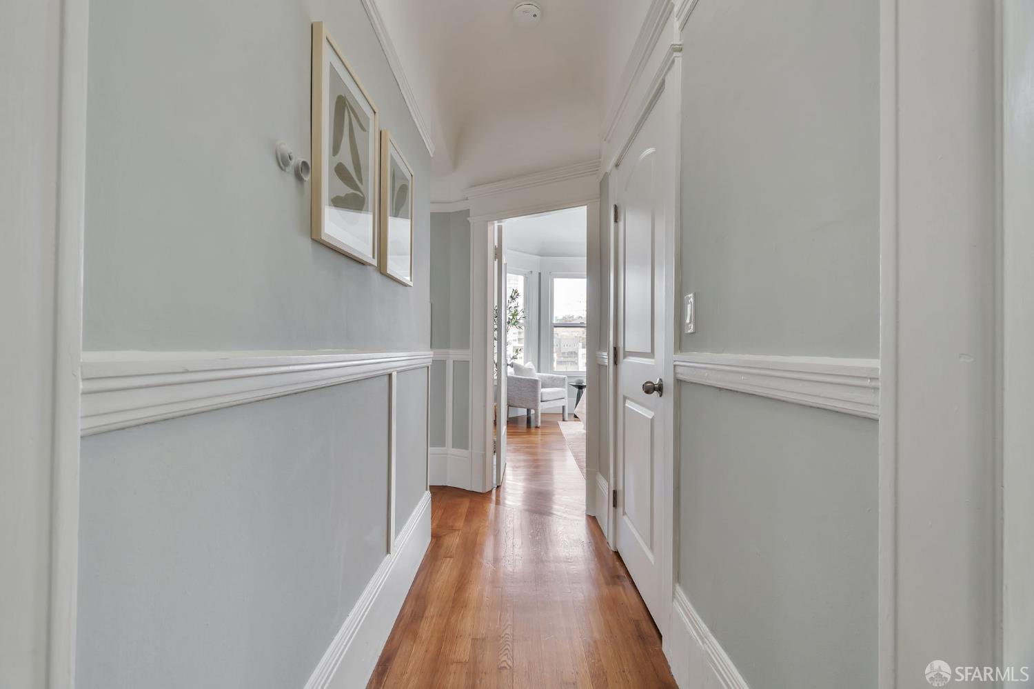 1180 Jackson Street, Unit 6 San Francisco, CA 94109 - Photo 18 of 48 a view of a hallway with wooden floor and staircase