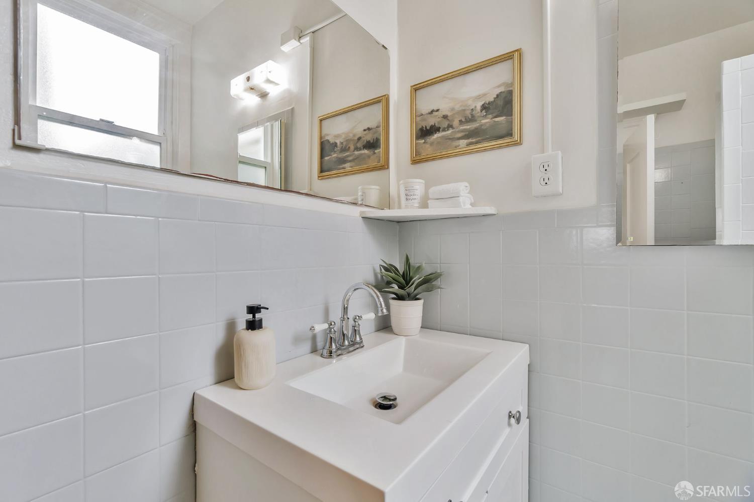 1180 Jackson Street, Unit 6 San Francisco, CA 94109 - Photo 26 of 48 a bathroom with a sink and a mirror