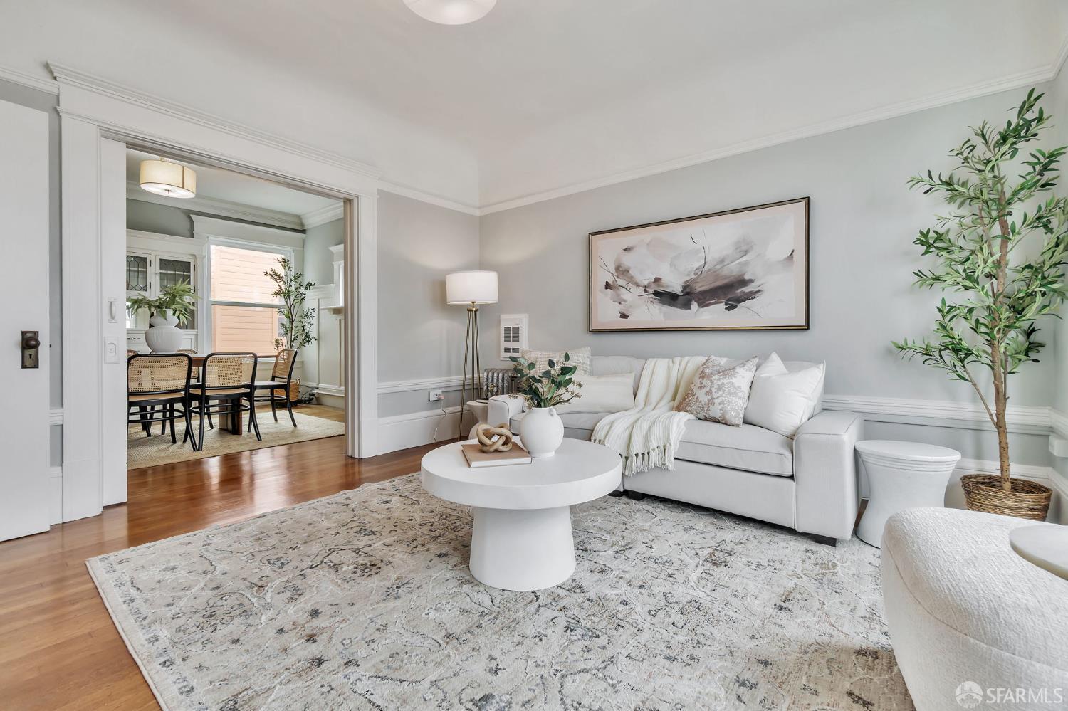1180 Jackson Street, Unit 6 San Francisco, CA 94109 - Photo 5 of 48 a living room with furniture a dining table and a potted plant