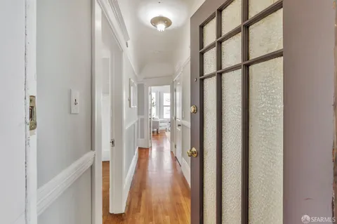 a view of a bathroom from the hallway