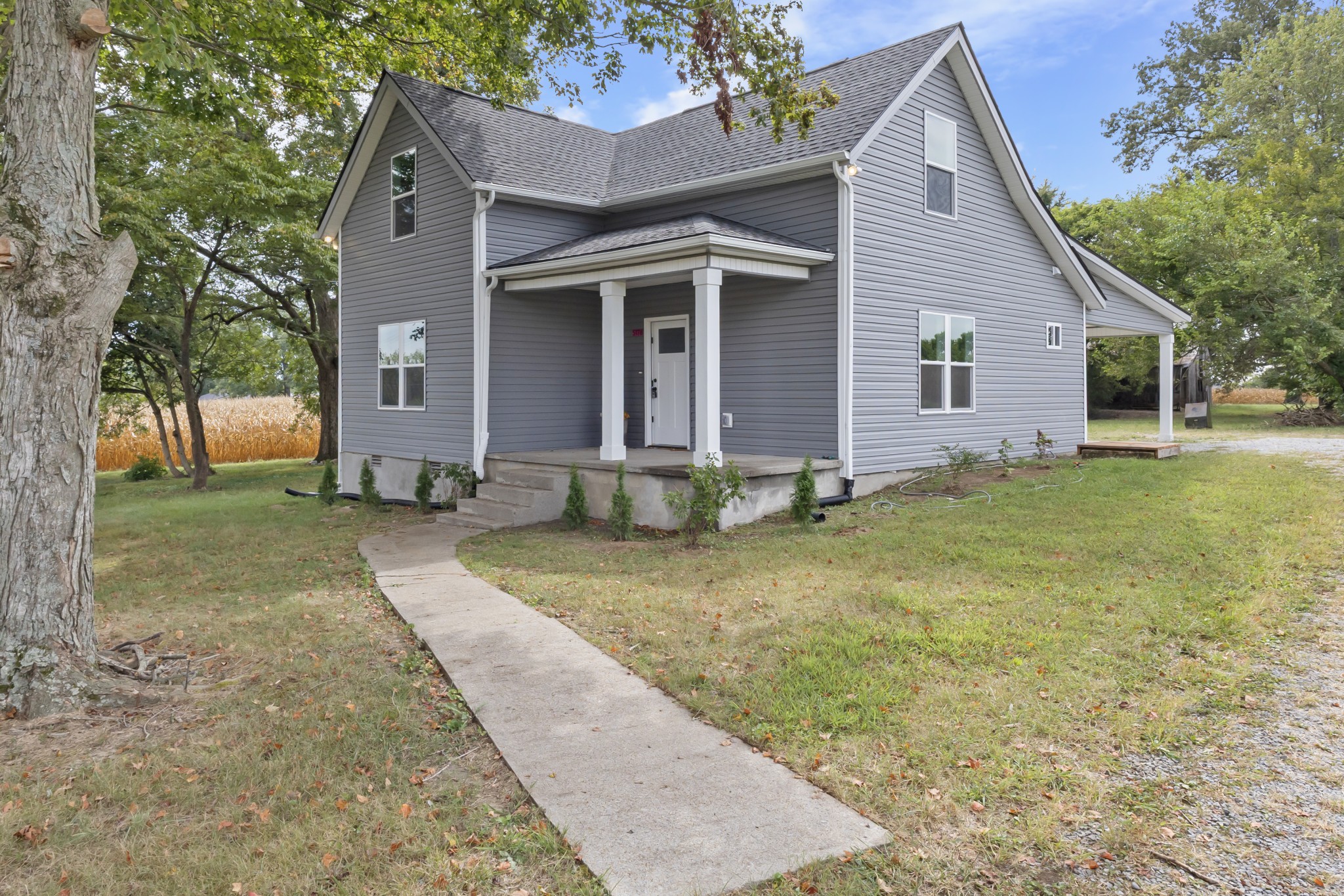 5178 East Robertson Road Cross Plains, TN 37049 - Photo 26 of 27 front view of a house with a yard