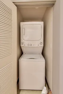 a view of a room with gym equipment and floor to ceiling window