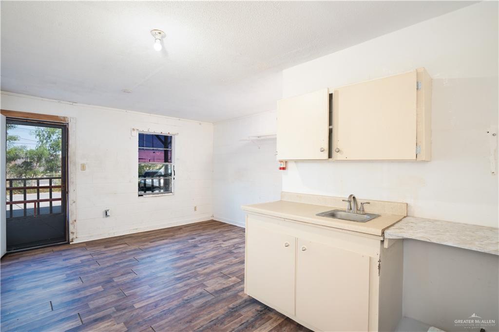 130 North Texas Avenue, Unit 8 Mercedes, TX 78570 - Photo 5 of 11 a view of a room with wooden floor and window