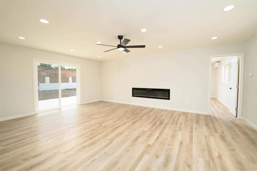1314 Bluegrass Road Vista, CA 92083 - Photo 6 of 16 a view of empty room with wooden floor and fan
