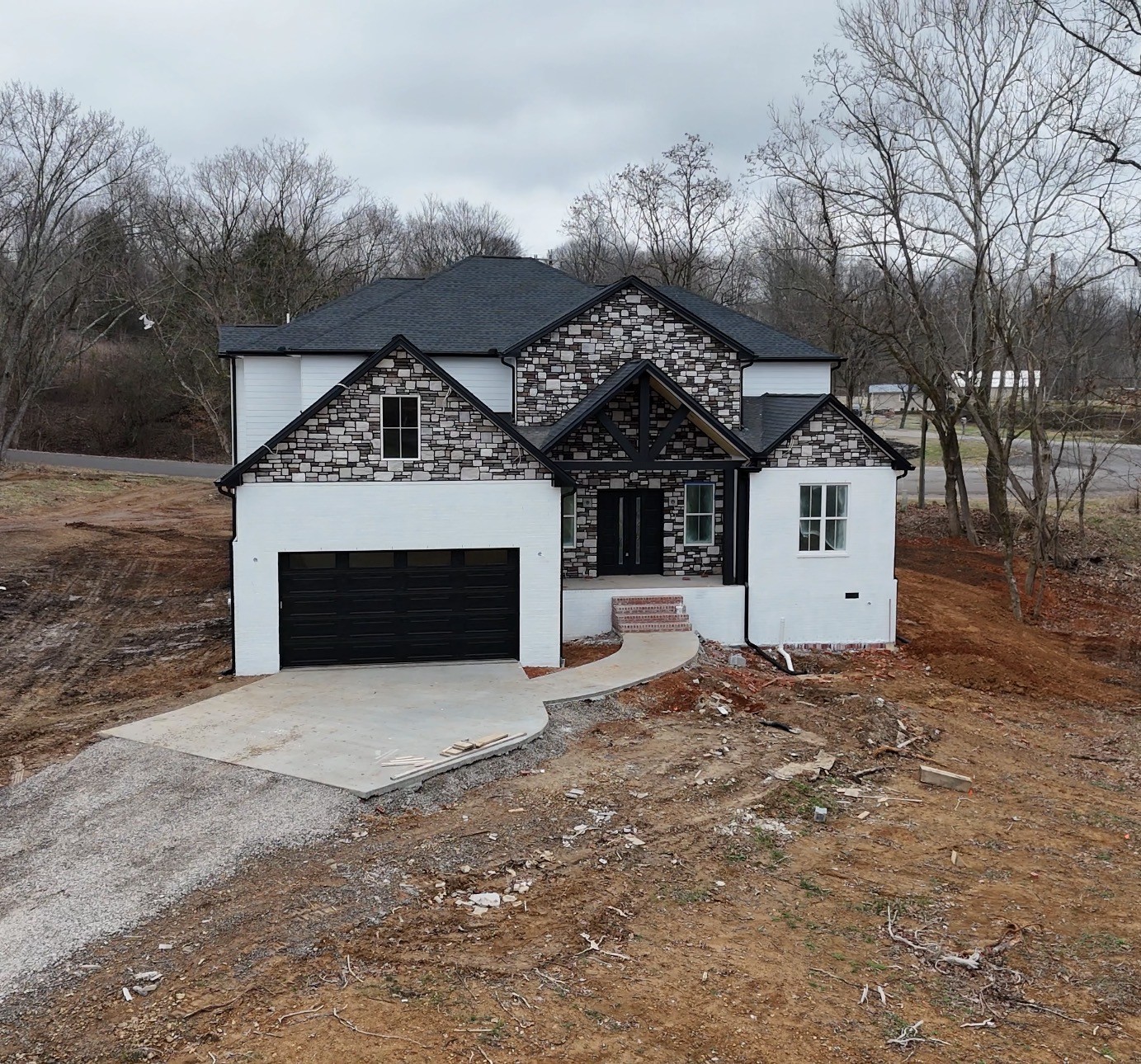 118 Keytown Road Portland, TN 37148 - Photo 4 of 5 a front view of a house with a yard and garage