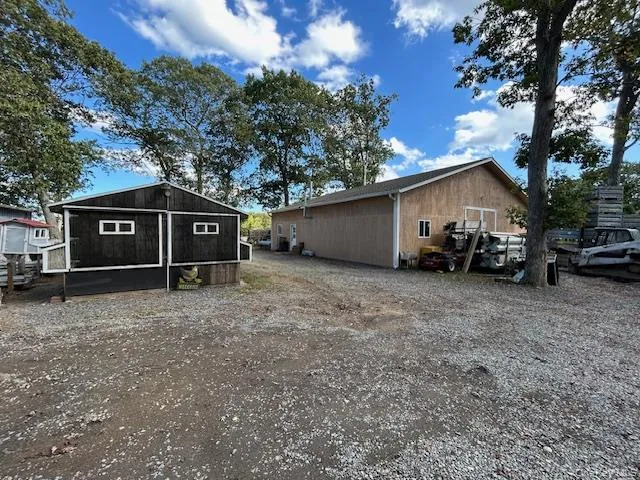 a view of a house with a yard and garage