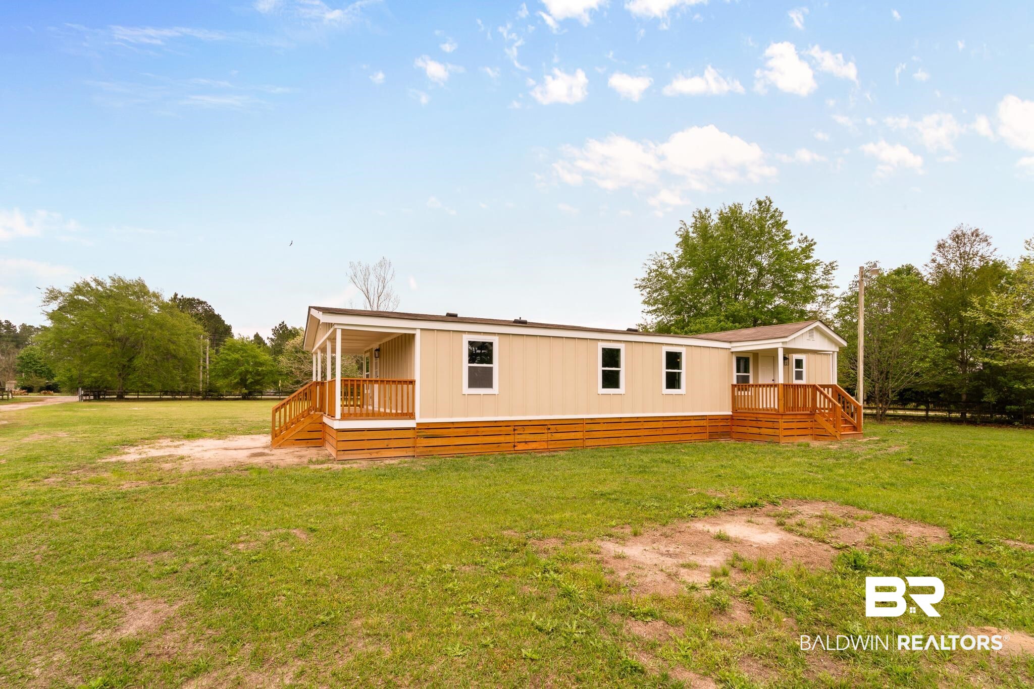 12645 Breman Road Elberta, AL 36530 - Photo 31 of 44 Rear view of house featuring a lawn