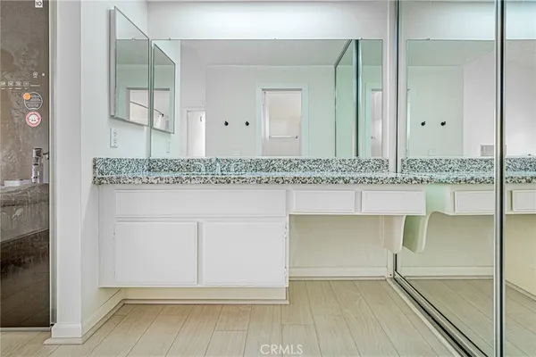 a spacious bathroom with a toilet a sink and a bathtub