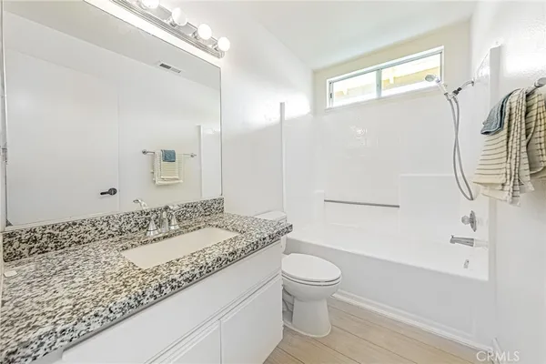 a view of a hallway with washer and dryer