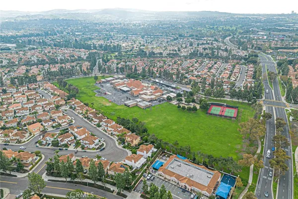 an aerial view of residential houses with outdoor space