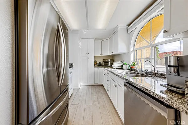 a kitchen with sink and window