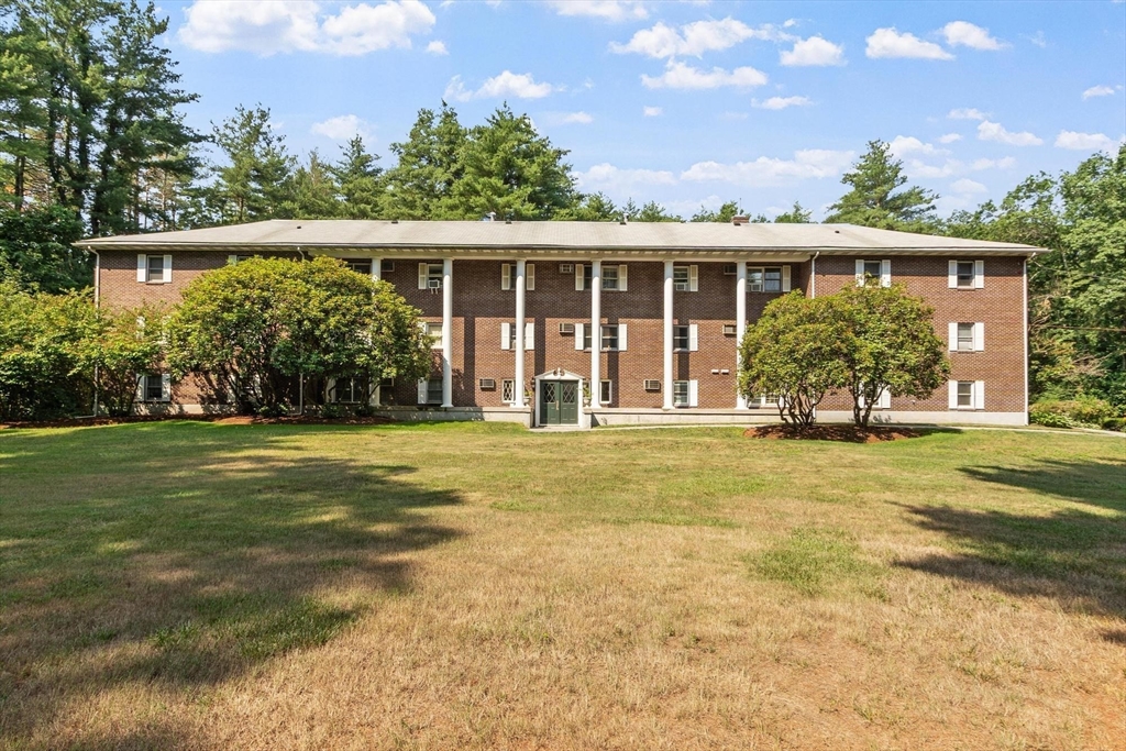 420 Great Road, Unit C1 Acton, MA 01720 - Photo 2 of 29 front view of a house with a yard