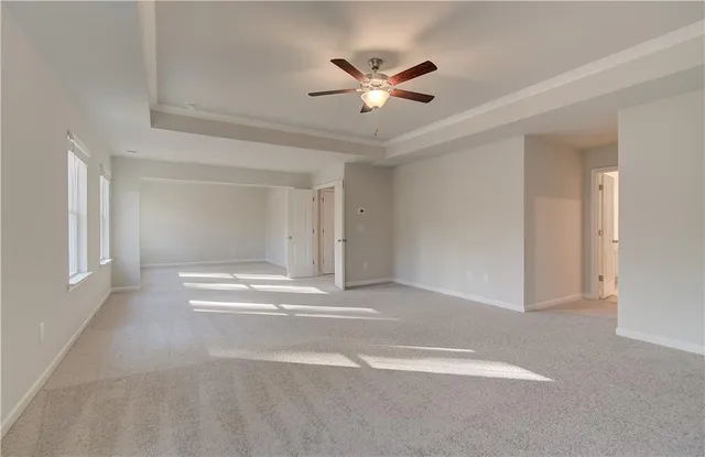 a view of livingroom with a ceiling fan and window