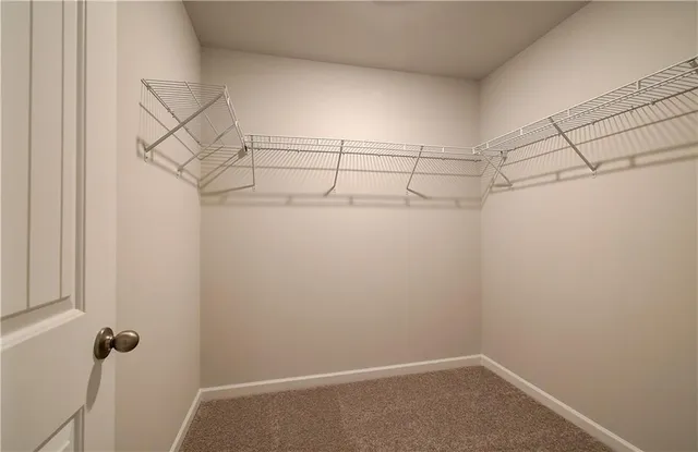 a view of a room with racks on the wall