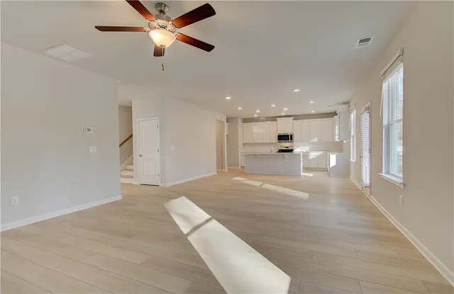 a view of a kitchen with a sink and dishwasher cabinet