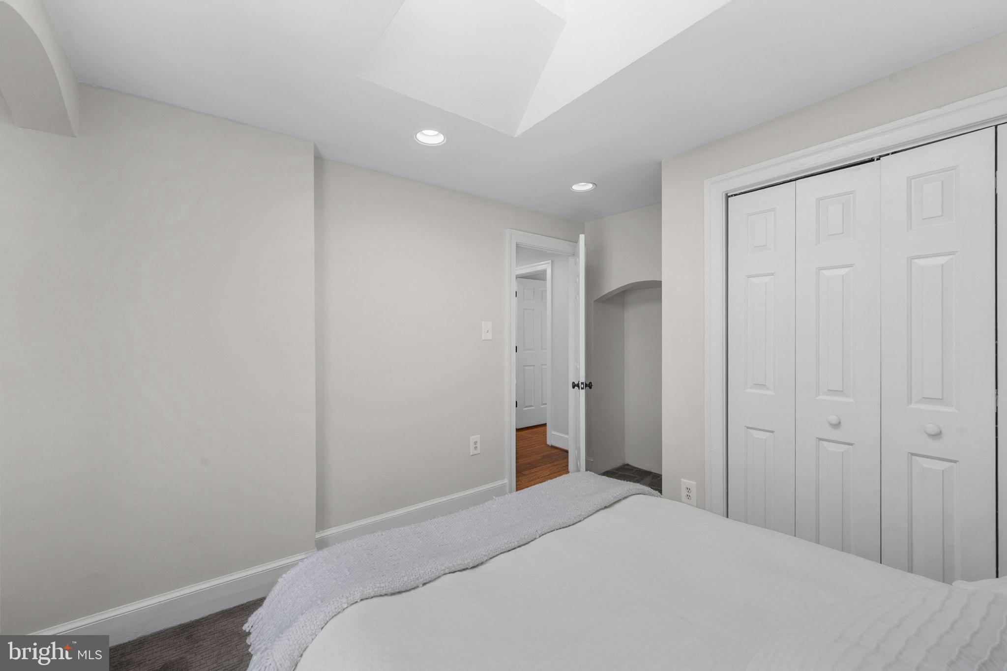914 15th Street Southeast Washington, DC 20003 - Photo 26 of 37 a bedroom with a bed and a bathroom
