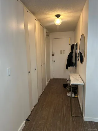 a view of entryway with wooden floor