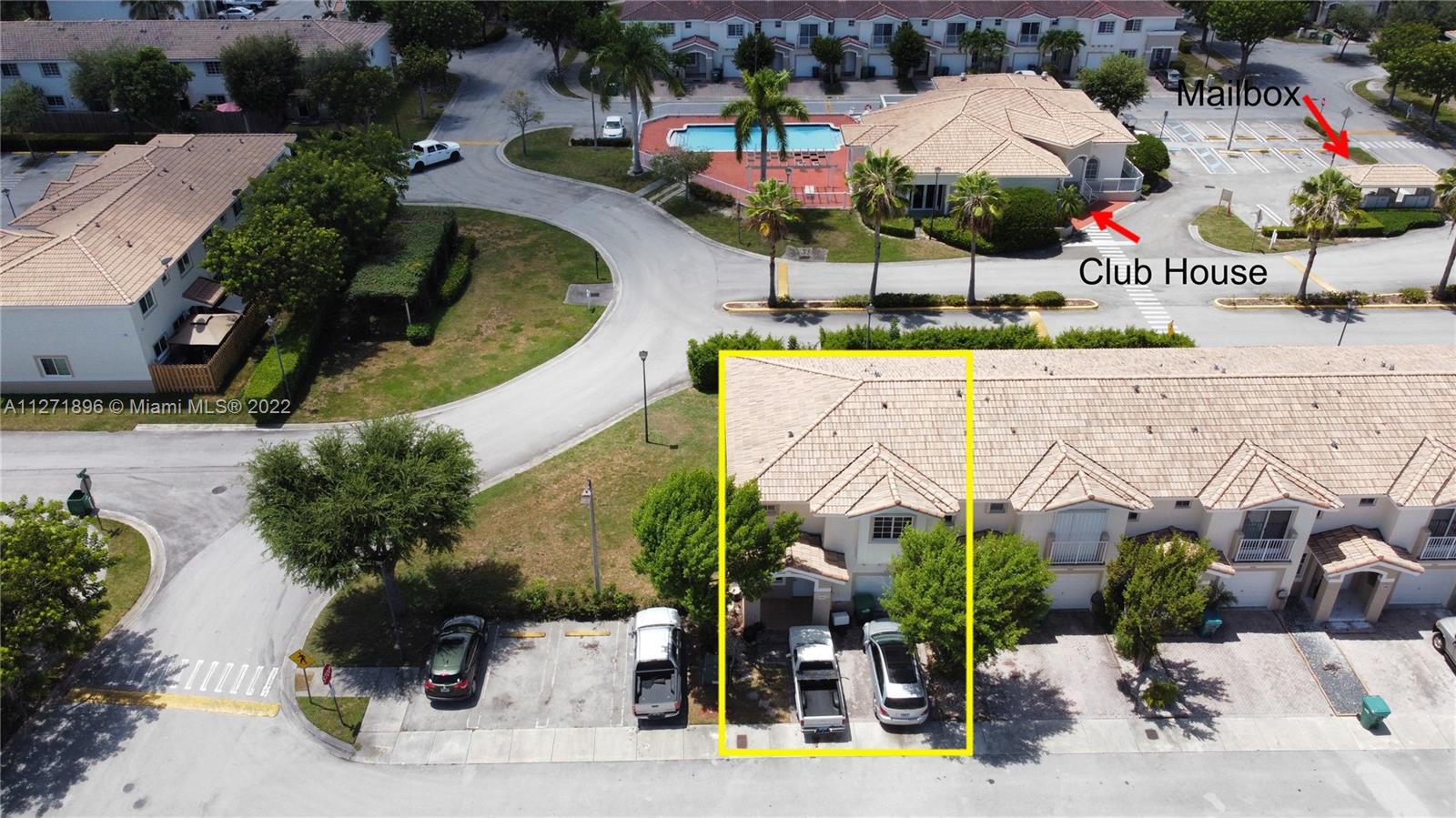an aerial view of a house with a swimming pool