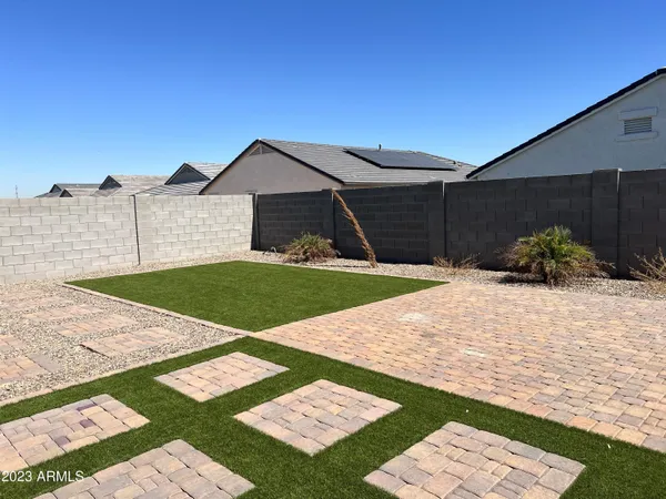 a view of a backyard of the house