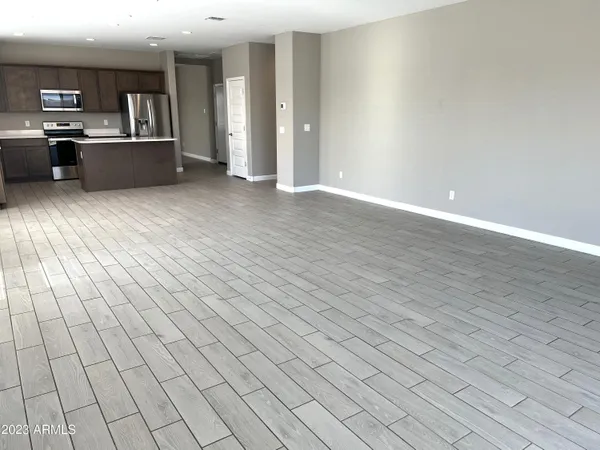 a view of large kitchen with cabinets