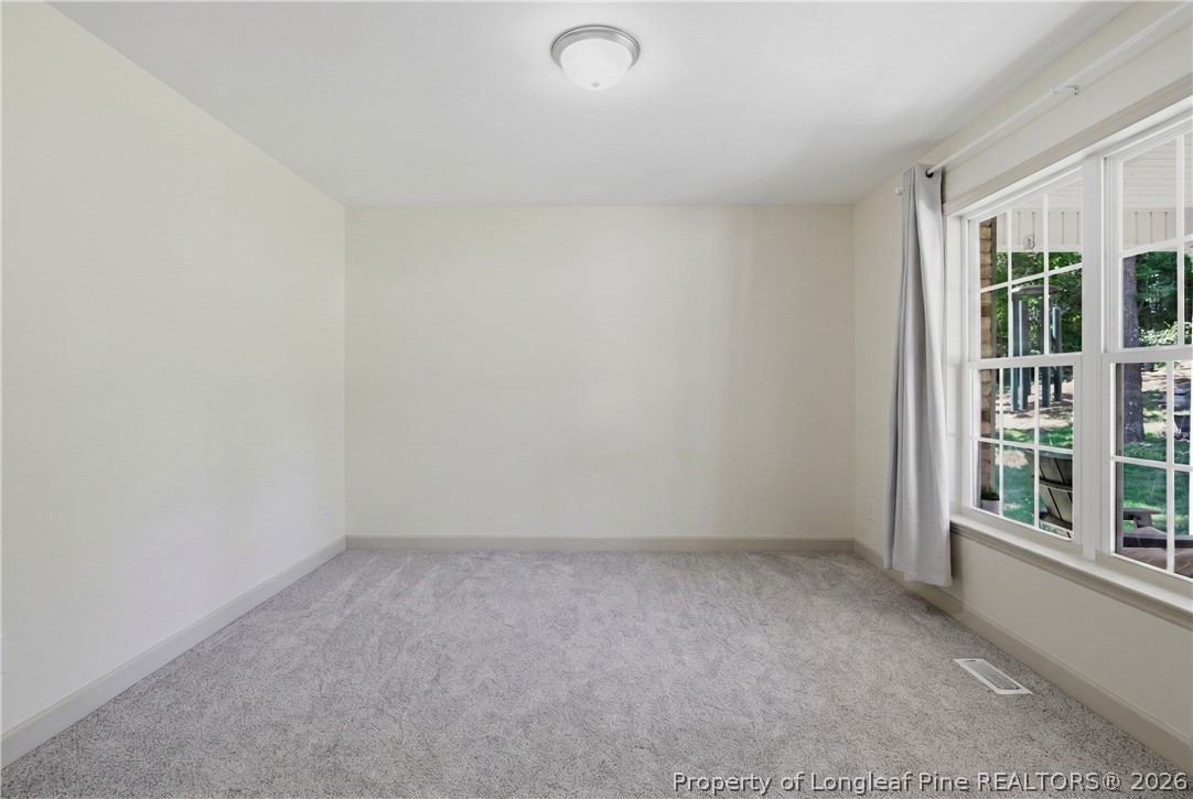 1075 Buffalo Lake Road Sanford, NC 27332 - Photo 5 of 49 an empty room with windows