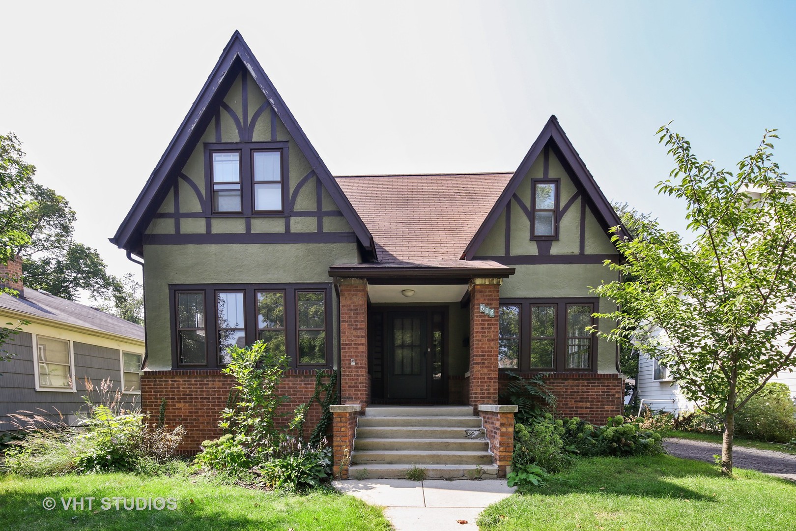 front view of a house with a yard