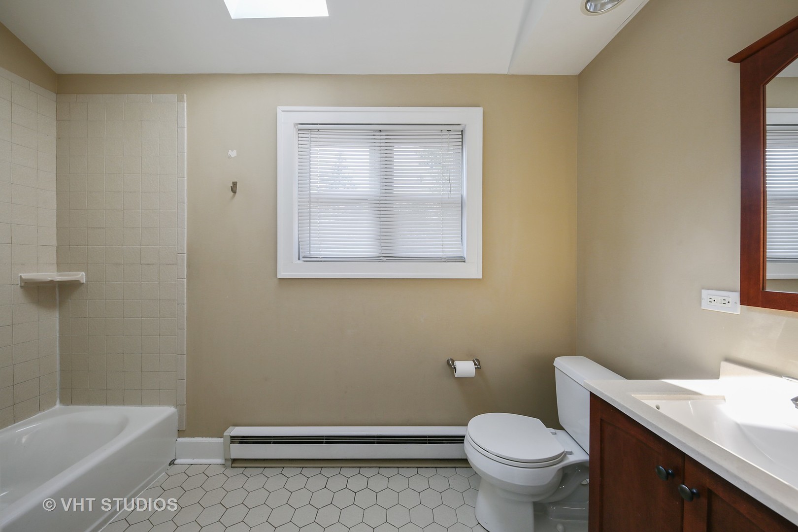 612 Spring Road Elmhurst, IL 60126 - Photo 15 of 19 a bathroom with a granite countertop toilet and a sink