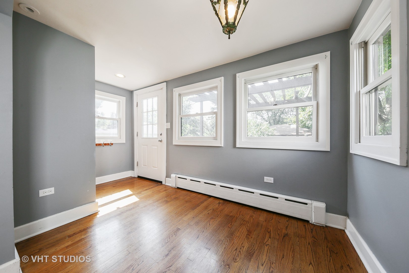 612 Spring Road Elmhurst, IL 60126 - Photo 3 of 19 a view of a room with wooden floor and window