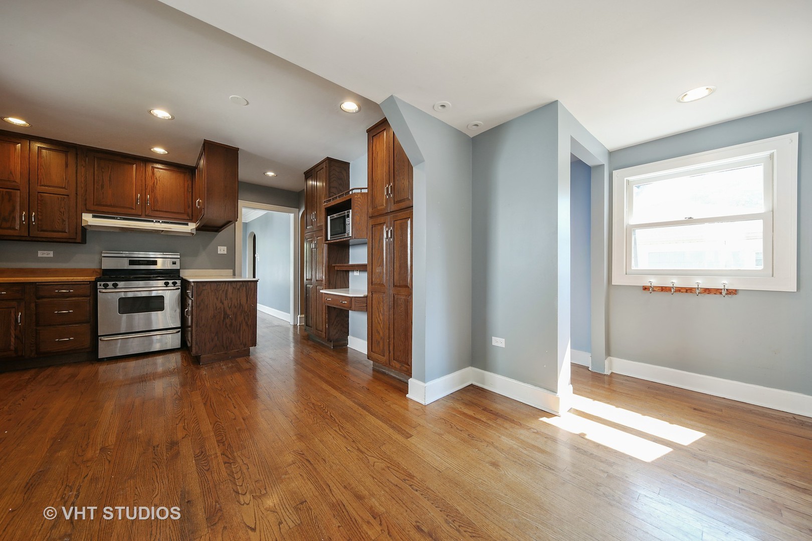 612 Spring Road Elmhurst, IL 60126 - Photo 4 of 19 a kitchen with stainless steel appliances granite countertop a refrigerator and a stove top oven