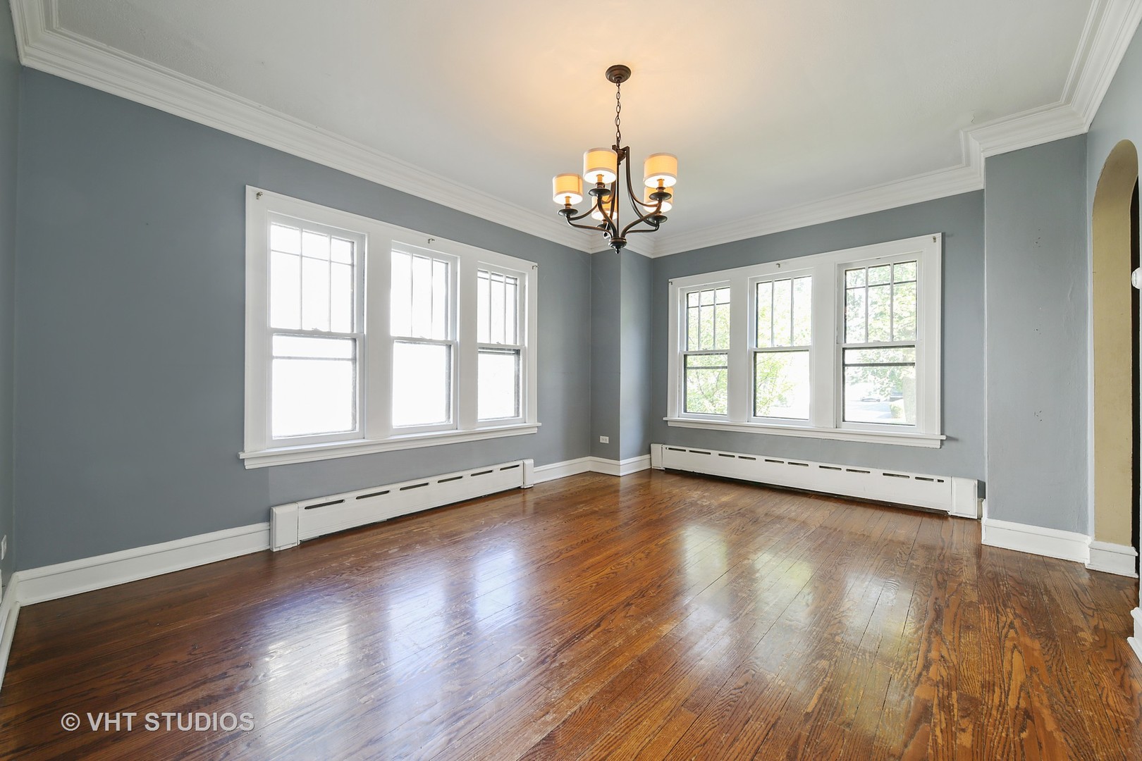 612 Spring Road Elmhurst, IL 60126 - Photo 5 of 19 a view of an empty room with wooden floor and a window