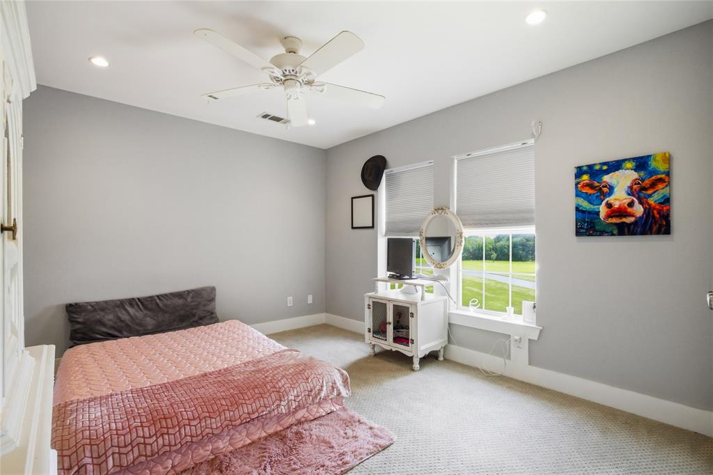 1073 Gordonville Road Gordonville, TX 76245 - Photo 24 of 38 Three upstairs bedrooms make room for family or guests. Each has a view of the beautiful landscape and/or pond.