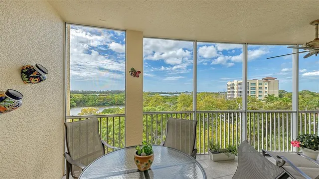 a bedroom with a bed and a view of balcony