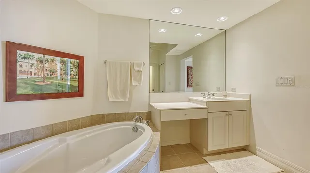 an aerial view of a house with a yard and outdoor seating