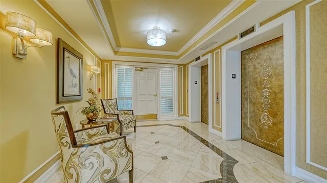a living room with furniture a rug and a flat screen tv