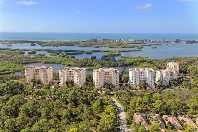 an aerial view of a houses with a lake view