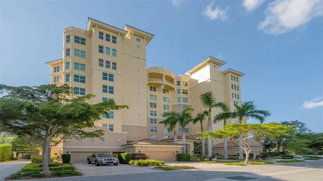 an aerial view of a residential houses with outdoor space and street view
