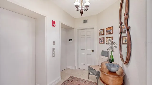 a living room with furniture a flat screen tv and a window