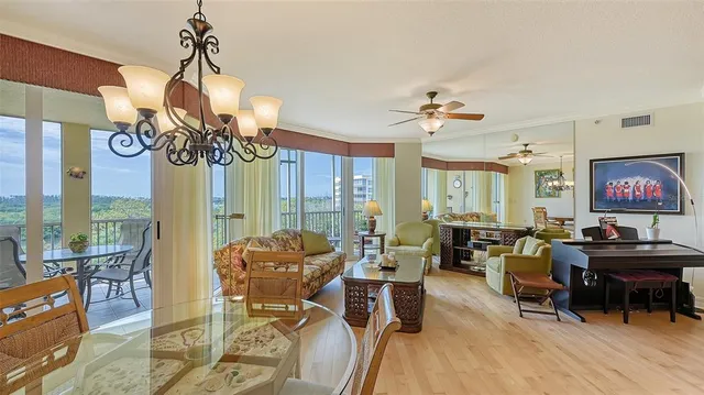 a kitchen with stainless steel appliances kitchen island granite countertop a refrigerator and microwave